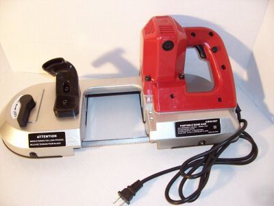 Portable metal band saw 4-1/2'' x 4-1/2'' cutting cap.