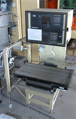 Used: garvins automations case check weigher, right to
